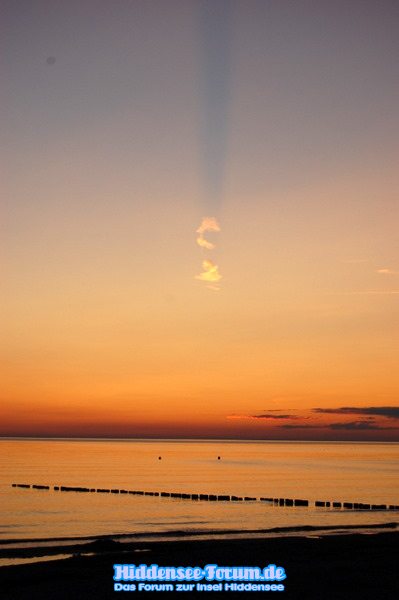Sonnenuntergang mit Wolke (Wirft Schatten)